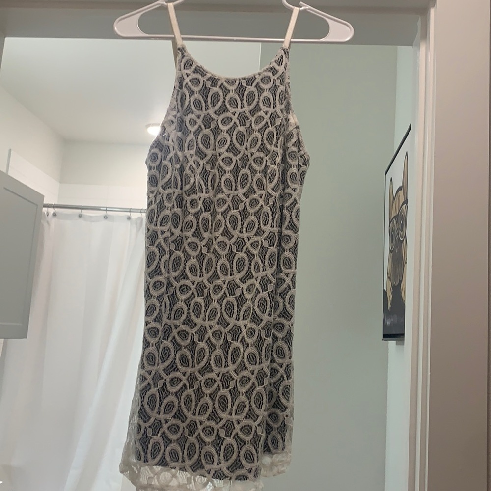 Super cute white strappy dress.